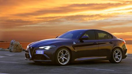 Sleek Beauty of the Alfa Romeo Giulia Quadrifoglio at Sunset wallpaper