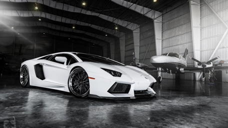 Lamborghini and Airplane in Hangar wallpaper