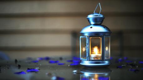 Soft Glow of a Candle Lantern in 4K Quality wallpaper