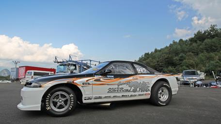Sleek Racing Machine in Dynamic Surroundings wallpaper