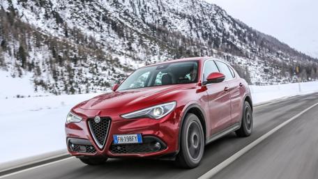 Dynamic Alfa Romeo Stelvio in Stunning Snowy Landscape wallpaper