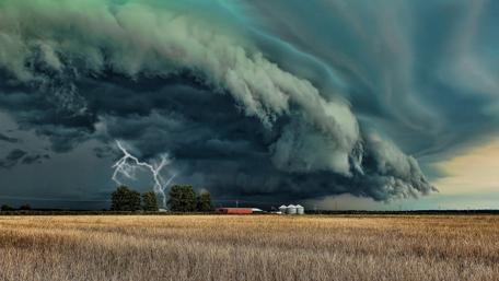 Majestic Storm Over Golden Fields wallpaper