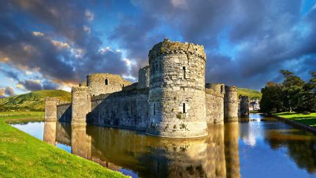Majestic Beaumaris Castle Reflection in Wales Waterway wallpaper