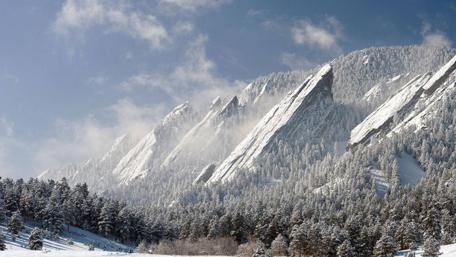 Majestic Snowy Flatirons in Colorado Winter Scene wallpaper