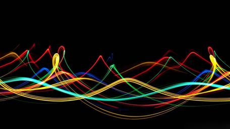 Vibrant Trails of Light in Darkness wallpaper