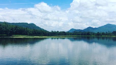 Tranquil Lake Under a Blue Sky wallpaper