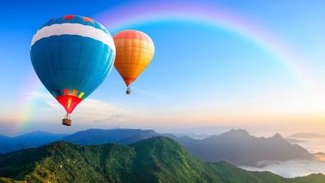 Rainbow Ride Over Misty Mountains wallpaper