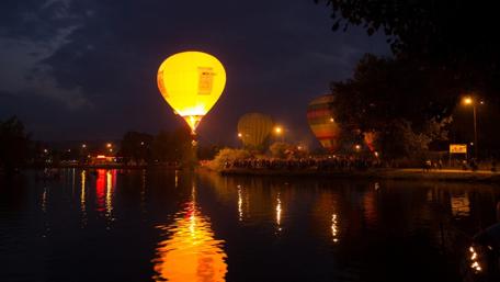 Bright Balloons Illuminating the Night Sky wallpaper
