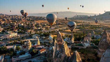 Breathtaking Hot Air Balloons Over Cappadocia Landscape wallpaper