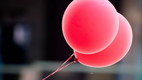 Joyful Pink Balloons Floating in the Air wallpaper