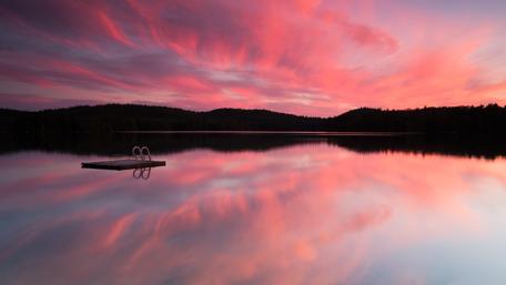 Stunning Sunset Reflection on Calm Lake wallpaper