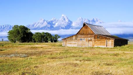 Serene Cottage in Mountain Farm Landscape wallpaper