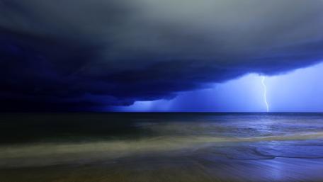 Lightning Illuminates the Stormy Coastline Sky wallpaper