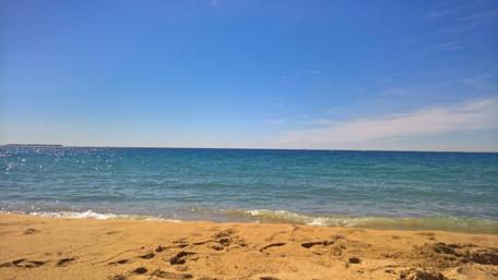 Serene Ocean View Under Clear Blue Sky wallpaper