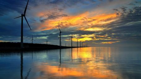 Tranquil Windmills Reflecting at Sunset wallpaper