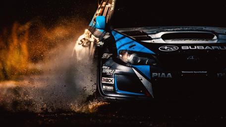 Dynamic Rally Charge Through Mud wallpaper