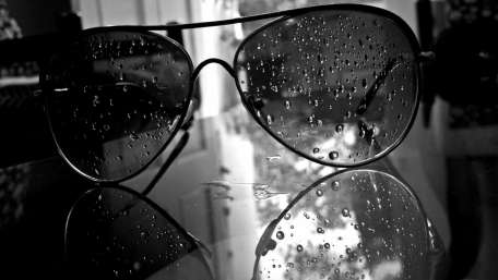 Reflections of Life Through Raindrop Glasses wallpaper