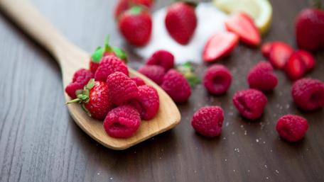 Delicious Raspberries on a Wooden Spoon wallpaper