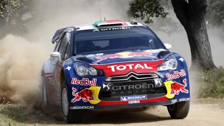 Fast-Paced Rally Car Action on Dirt Track wallpaper
