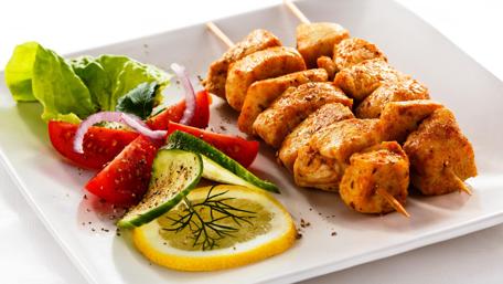 Grilled Chicken Skewers and Fresh Salad Delight wallpaper