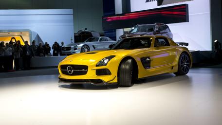 Sleek Mercedes Supercar at Auto Show Displaying Power and Style wallpaper
