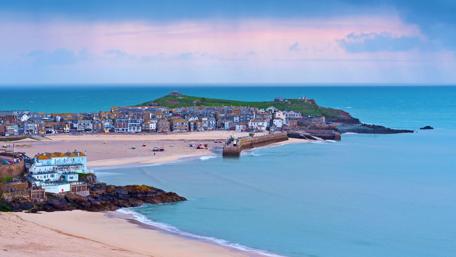 Serene Coastal Cityscape Under Blue Sky wallpaper