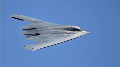 B2 Stealth Bomber Soars Through Blue Skies wallpaper