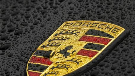 Gleaming Porsche Emblem in Raindrops wallpaper