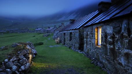 Evening Serenity in a Misty Stone Cottage wallpaper