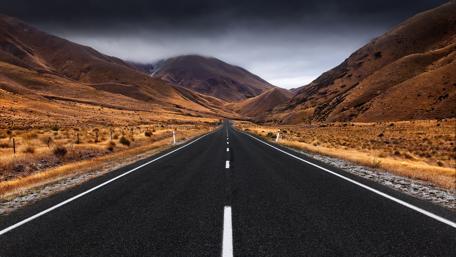 Endless Road Through Majestic Hills wallpaper