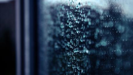 Raindrop Symphony on Glass Surface wallpaper