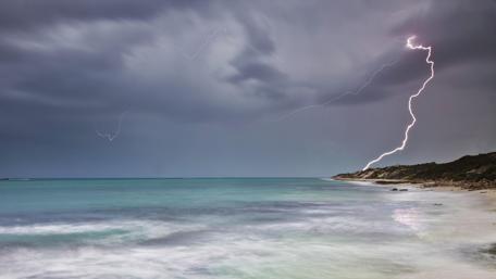 Stormy Coastal Lightning Display in 4K Clarity wallpaper