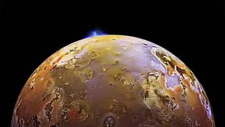 Majestic Io Volcanic Eruptions Beneath Jupiter's Gaze wallpaper