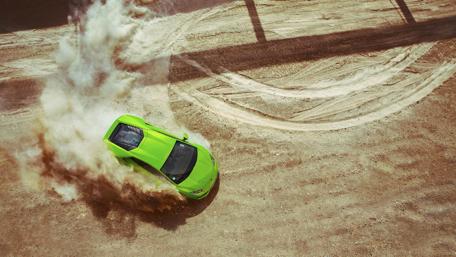 Green Lamborghini Huracan in Desert Drift wallpaper
