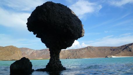 Majestic Rock Formations Over Serene Waters wallpaper