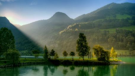 Sunrise Splendor Over Serene Lake and Mountains wallpaper