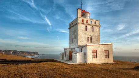 Lighthouse Serenity on Icelandic Coastline wallpaper
