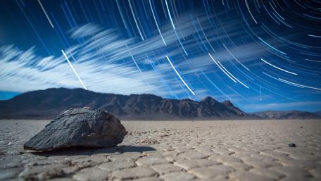 Star trails over Racetrack Playa wallpaper
