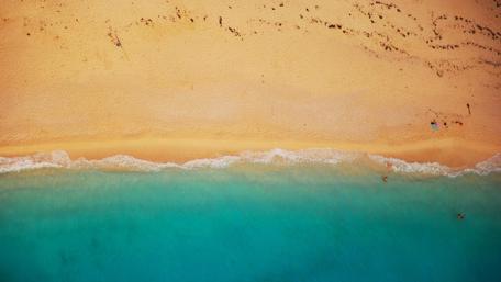 Tranquil Beach Serenity in Tones of Blue and Gold wallpaper