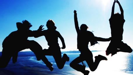 Joyful Moments with Friends in Mid-Jump wallpaper