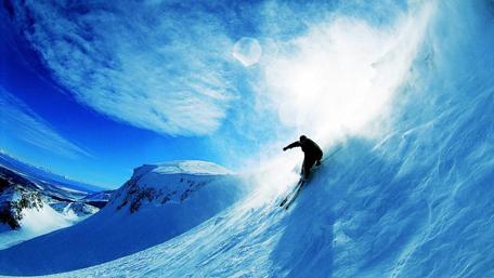 Thrilling Descent on Snowy Slopes wallpaper