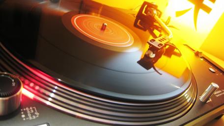Spinning Vinyl Under Warm Lights wallpaper