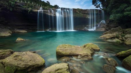 Enchanting Krang Suri Waterfall Scene wallpaper