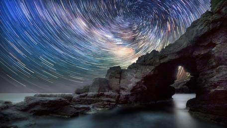 Stunning Star Trails Over Rocky Arch wallpaper