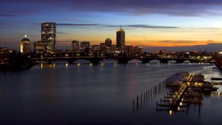 Serene Evening Cityscape with Illuminated Skyline wallpaper