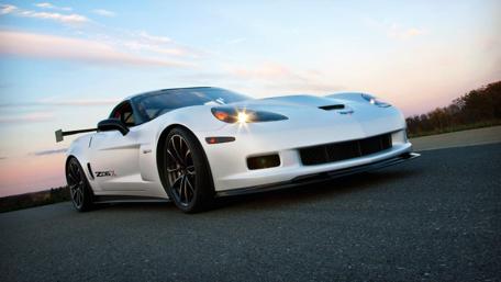 Sleek White Corvette on a Sunset Road wallpaper