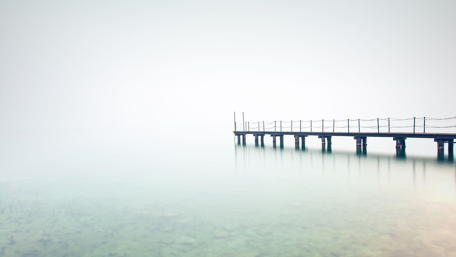 Serene Foggy Lake View with Scaffolding Pier wallpaper