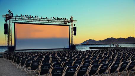 Open-Air Cinema by the Sea at Sunset wallpaper