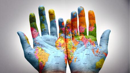 Hands Holding the World Map in 4K Clarity wallpaper