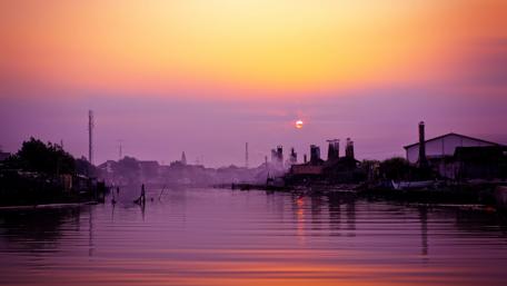 Serene Sunset Over Indonesian Waterway wallpaper